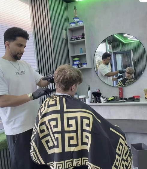 Fadezone Barbers barber cutting a client's hair inside the Shirley Road shop