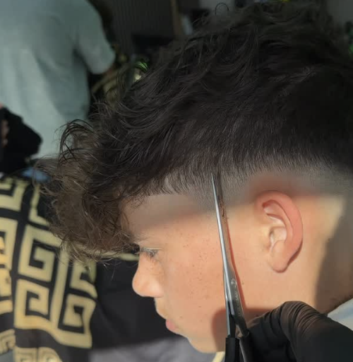 Fadezone Barbers scissor cut detail on curly hair