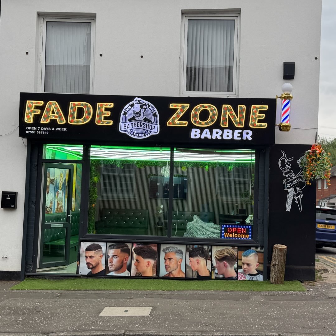 Fadezone Barbers illuminated shopfront and signage on Shirley Road, Southampton