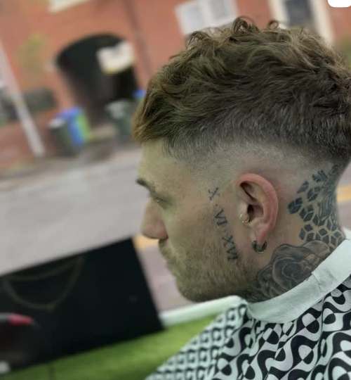 Close-up of a sharp skin fade finished by Fadezone Barbers